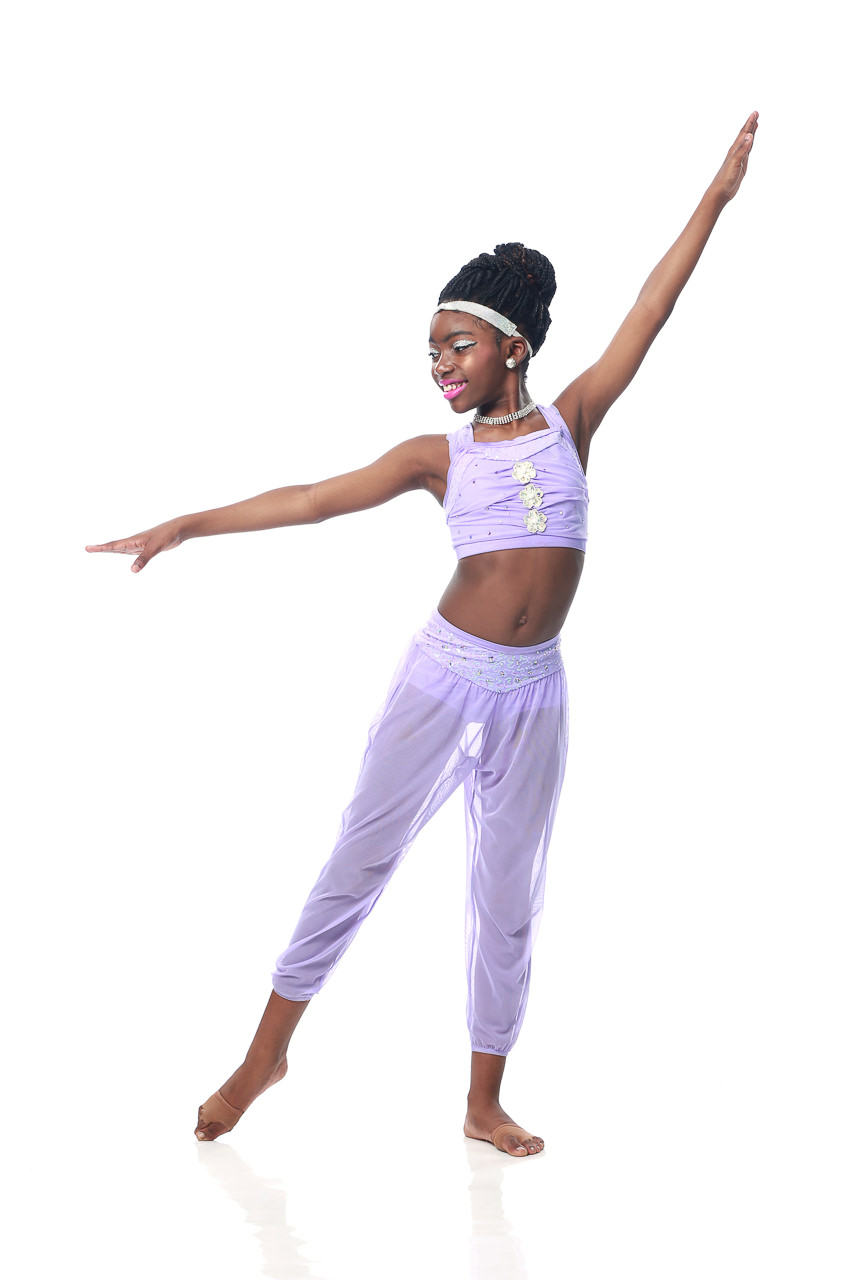 Young female dancer in lilac colored dance costume poses for dance recital photography in Exulting Images’ Fort Mill SC studio
