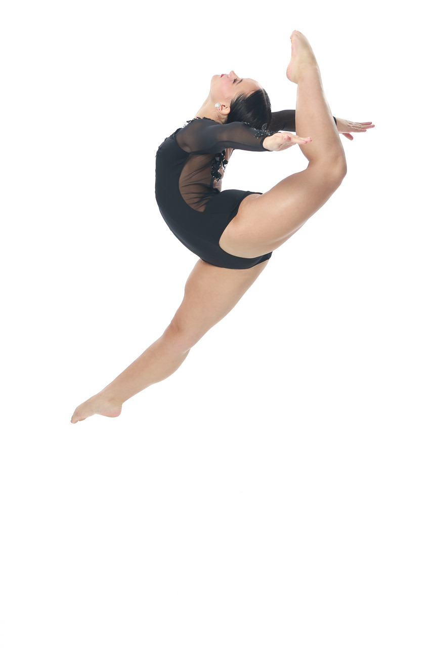 Dance action shot of female dancer leaping for dance recital photography in Exulting Images’ Fort Mill SC studio