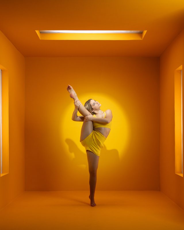 dancer orange cube, leg grab, dance